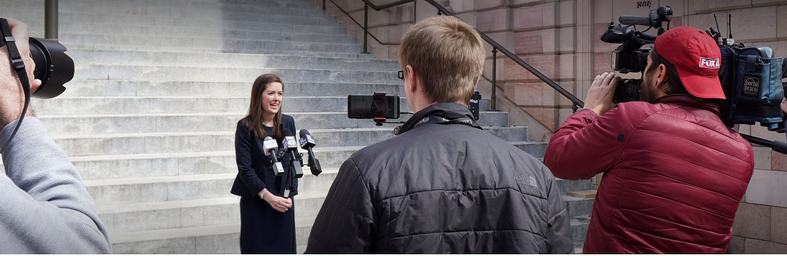 Kirby West speaks with reporters